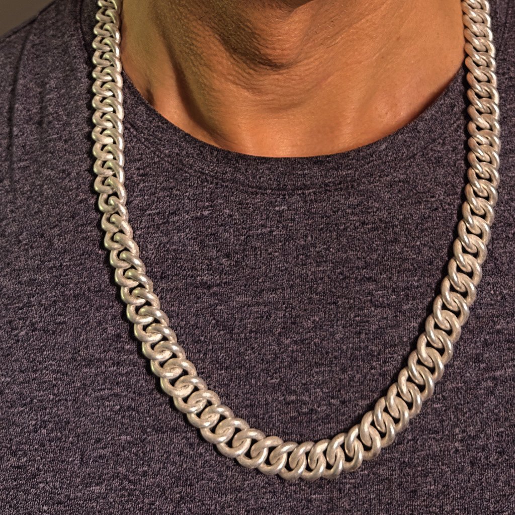 Curb chain necklace on man