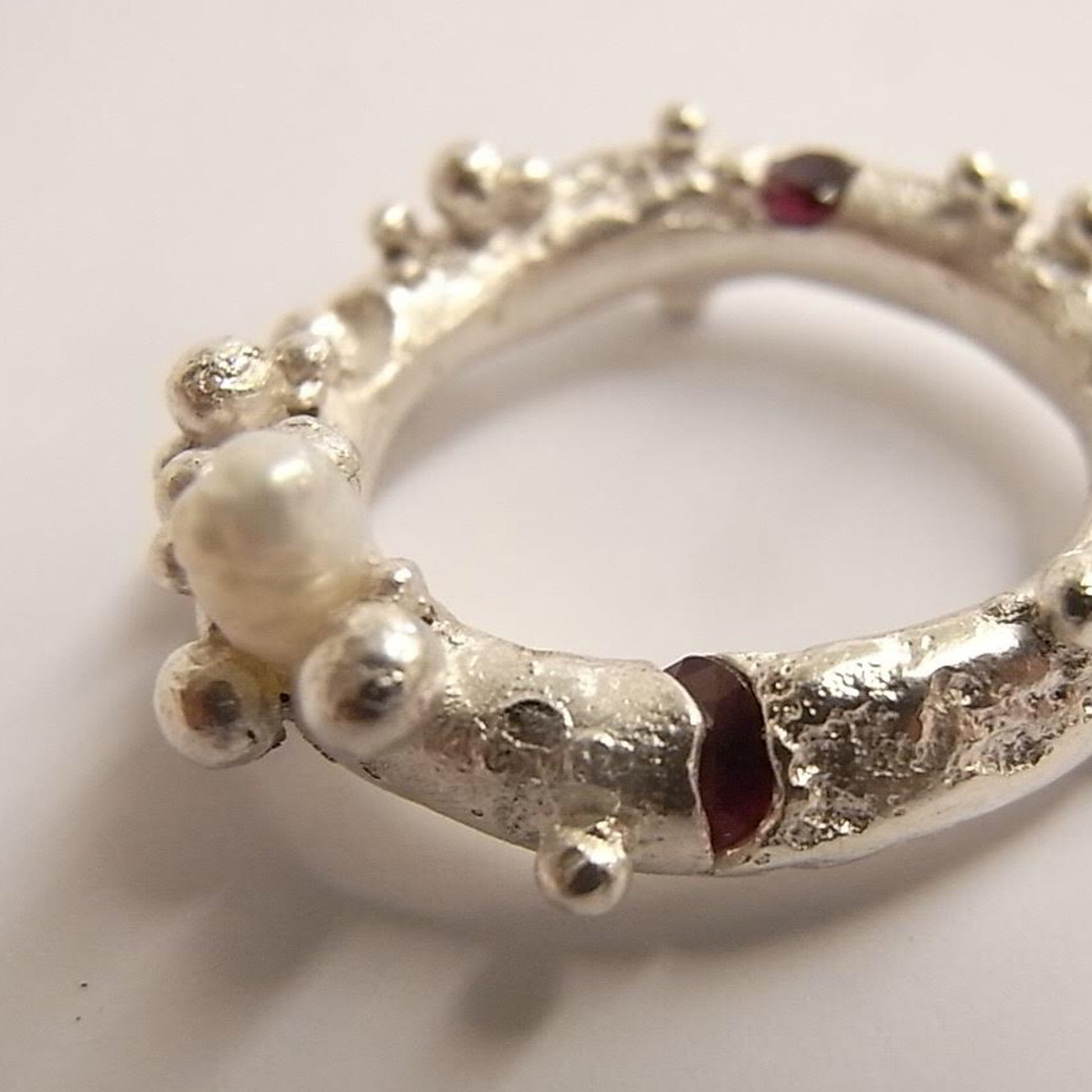 Silver ring with synthetic ruby close up