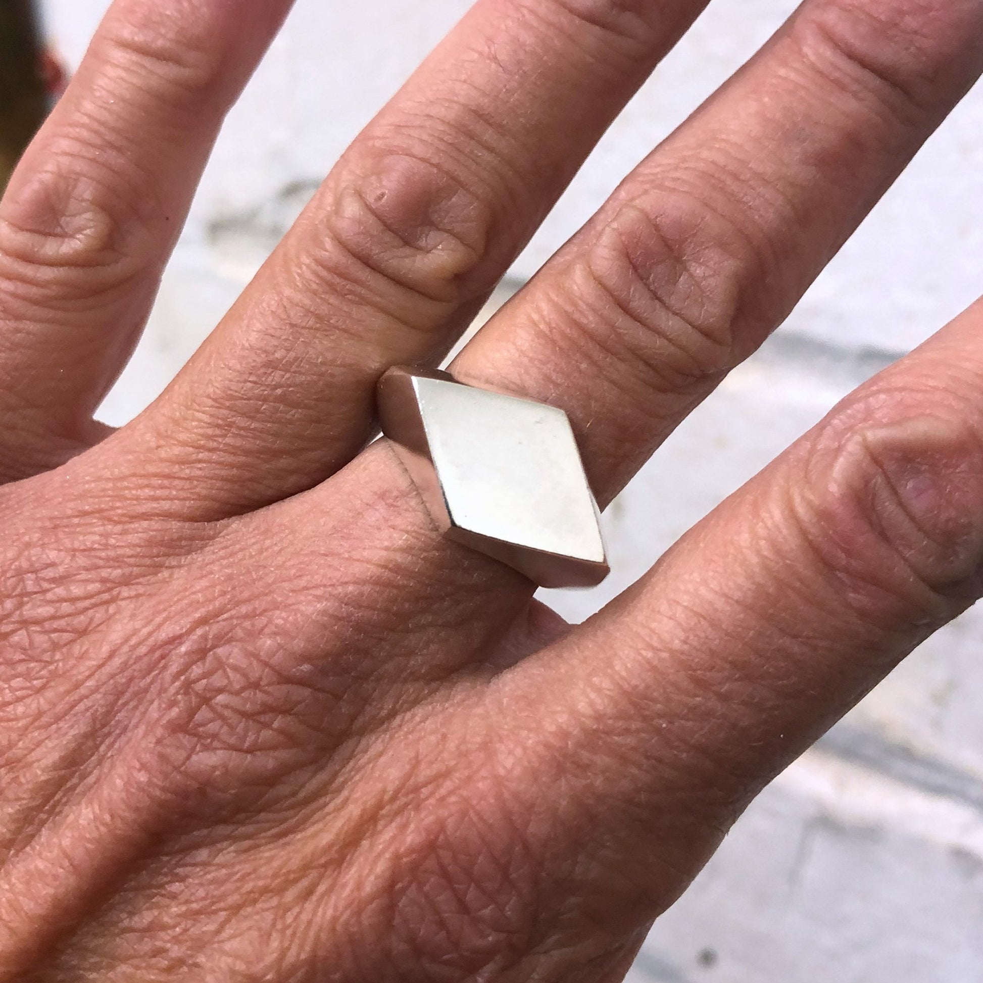 Rhombus ring diamond shape on finger