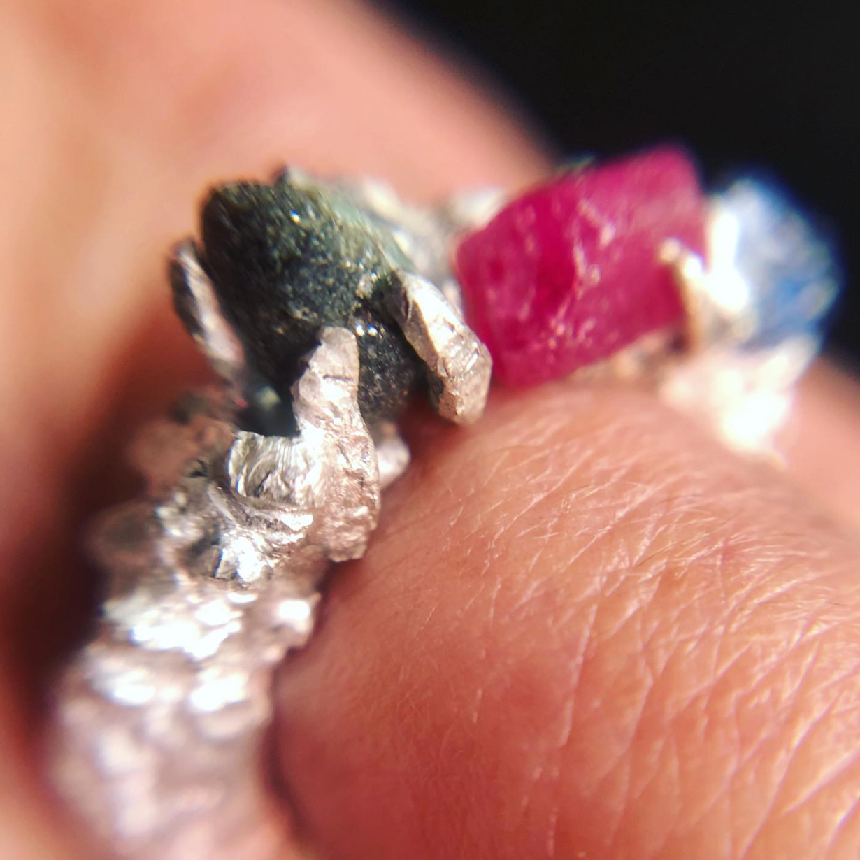 Detail of the rough rubies and sapphires ring